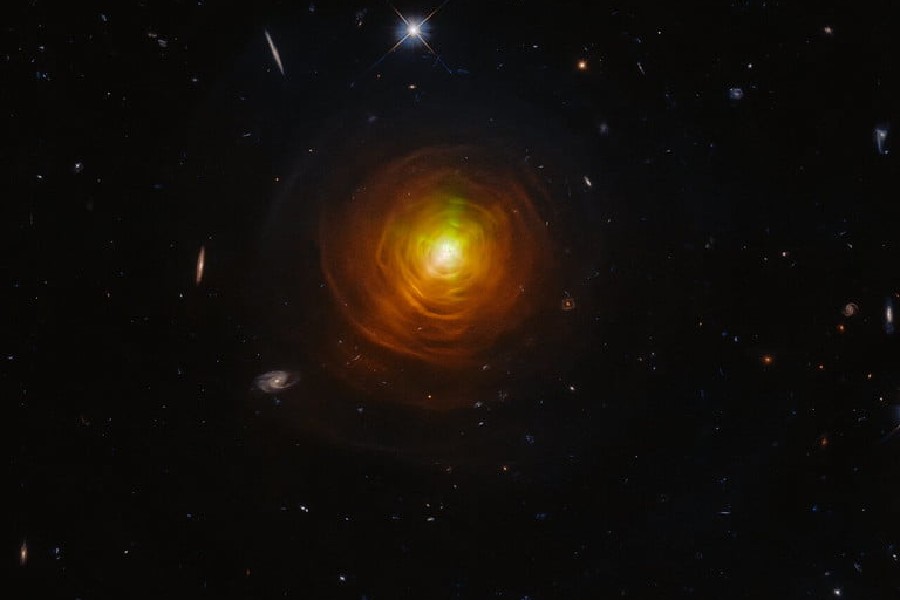 Hubble snaps carbon star CW Leonis peeking out of smoke ring